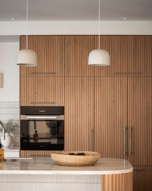 Ceramic dome pendant styled in a japandi kitchen