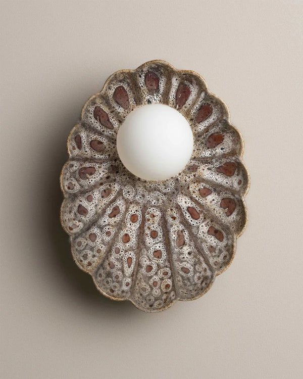 Handmade oyster wall sconce in white ochre