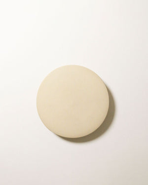 Small ceramic disc wall light in bone finish