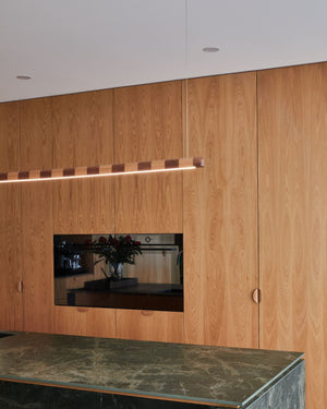 Stripy timber linear above a marble bench