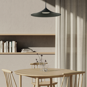 Flat Black Cymbal Pendant Light over a dining table