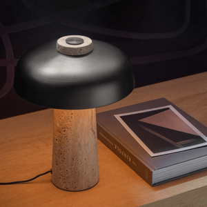 Curved Aluminium and Travertine Table Lamp | Reverse on a console table near a book