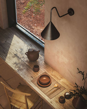 Interior Cone Gooseneck Wall Light over a wooden table