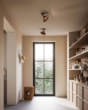 Antique Brass Rotatable Ceiling Lamp Displayed in the back room of a modern rustic kitchen
