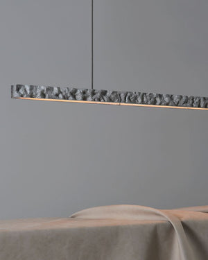 Carst Linear Pendant hung above interior table