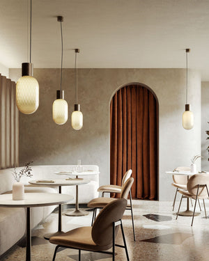 Designer Perfume Bottle Inspired Glass Pendant Light | Bloom | Bronze in a cafe