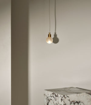 Minimalist Metal and Glass Spherical Pendant | Fabric Flex | Orb | Small | Brass | Clear Frosted | Lighting Collective