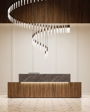 Tubular Moroccan pendant constellation above a modern entrance desk