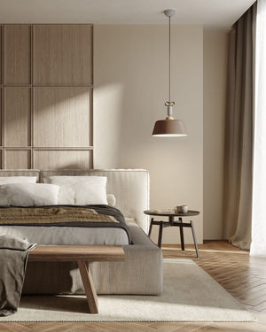 matte brown wide pendant displayed over a bedside table in a coastal Mediterranean bedroom