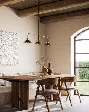 Italian Farmhouse Three Light Rod Pendant In a warm neutral living room