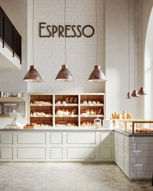 Three large dome pendant displayed over the counter of a traditional bakery