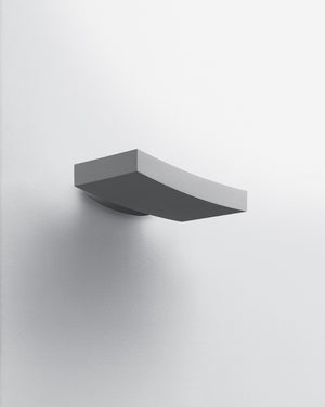 Modern wall-mounted light fixture on a white background
