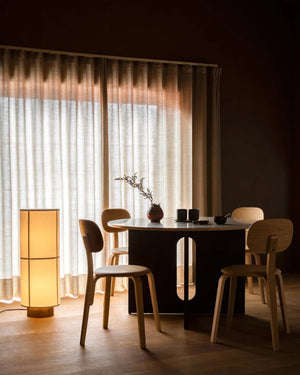 Minimalist Linen Floor Lamp Hashira with grid linen shade illuminated beside dining table in warm atmospheric interior