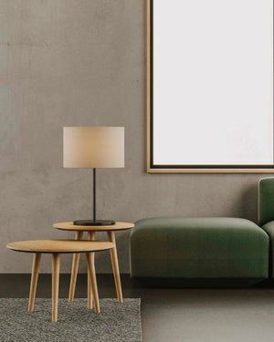 Modern living room with a green sofa, wooden side tables, and a Minimalist Marble Table Lamp