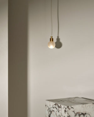 Minimalist Metal and Glass Spherical Pendant | Fabric Flex | Orb | Small | Brass | Clear Frosted | Lighting Collective