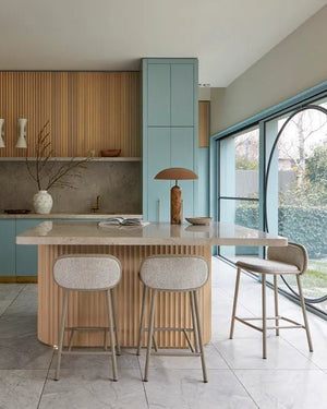 Minimal table lamp with a tuscan marble base on a modern kitchen island bench