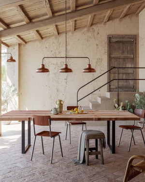 Three light pendant displayed in a sheltered terrace of a rustic house 