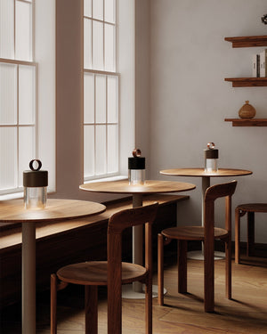 Modern interior with wooden tables with Modern Ridged Glass Portable Lamp on top