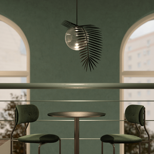 Modern Palm Leaf and Orb Pendant | Lighting Collective | brass and transparent in a restaurant