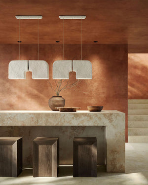 Organic Ceramic Pendant Light pair suspended above stone kitchen island with wooden stools in terracotta interior