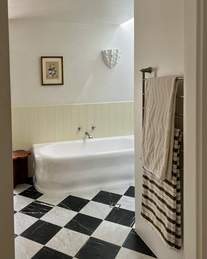 Organic Sculpted Wall Sconce Styled in a Modern Farmhouse Bathroom