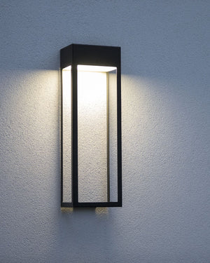 Rectangular wall sconce with black frame installed on outdoor wall