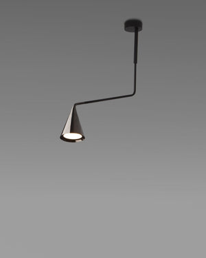 Modern pendant light with black arm and cone-shaped shade on a gray background
