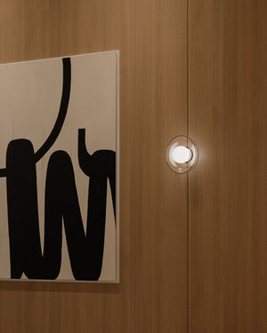 Sculptural Glass Orb Wall Light Installed Next to Artwork
