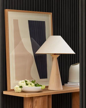 Tapered timber table lamp in natural white finish styled on oak console in contemporary interior