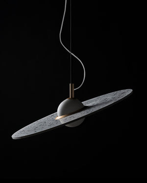 Modern pendant light with terrazzo shade on a black background