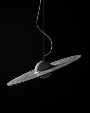 Modern pendant light with terrazzo shade on a black background