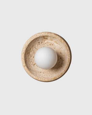 Travertine dish sconce on grey background