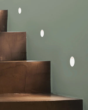 Staircase with step lights illuminating them