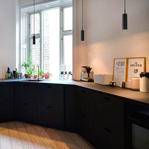 Adjustable Tube Pendant Light black finish in a kitchen