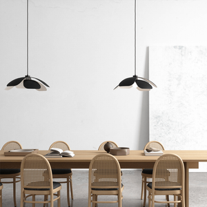 Modern Metal Large Flower Pendant Lights black finish over a dining table in a scandinavian styled room