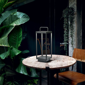 Modern Outdoor Anthracite Lantern Medium on a table in a patio